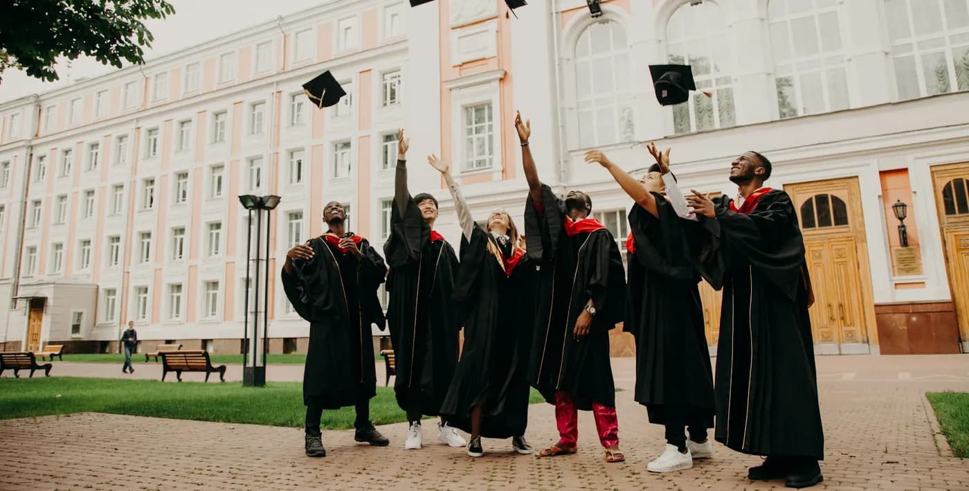 Graduates throwing their caps in the air