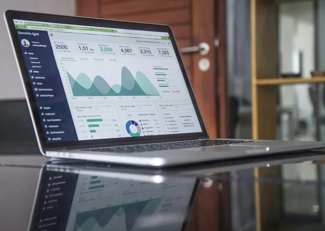 A laptop showing a clinic finance dashboard